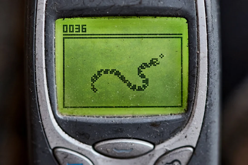 Close-up of the Snake game on Nokia phones' pixelated green display